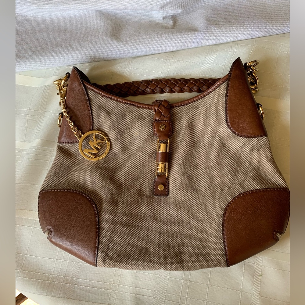 Authentic Michael Kors canvas /hemp purse with leather trim.
